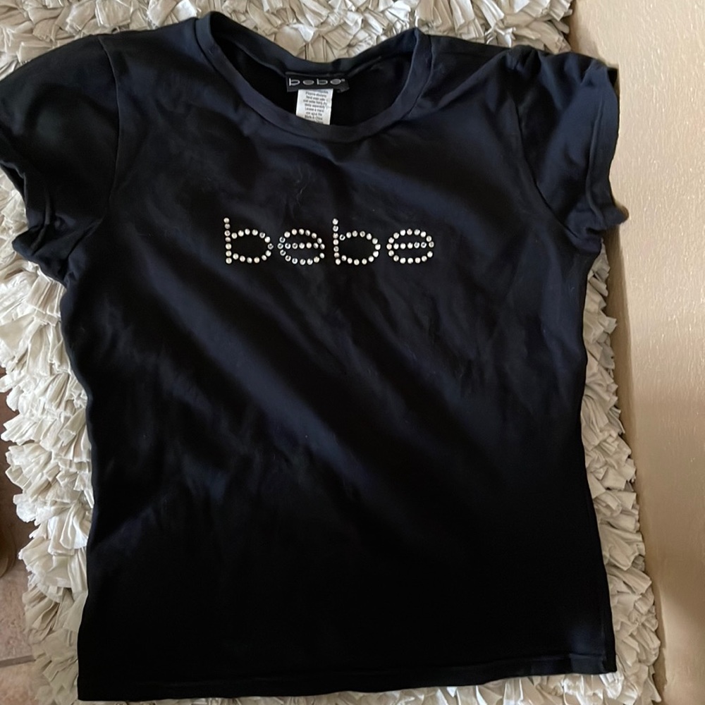 Bebe size L , form fitting T in great shape. Wore for birthday only.